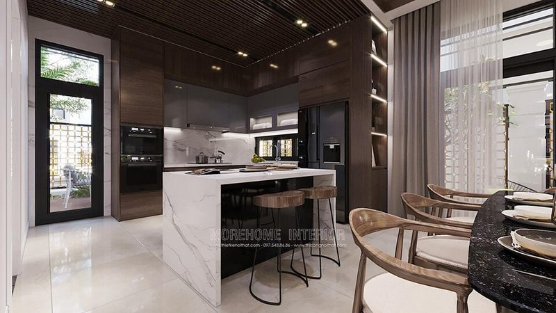 Đá nhân tạo có màu trắng được ốp lên bàn đảo bếp giúp tạo nên sự sang trọng.